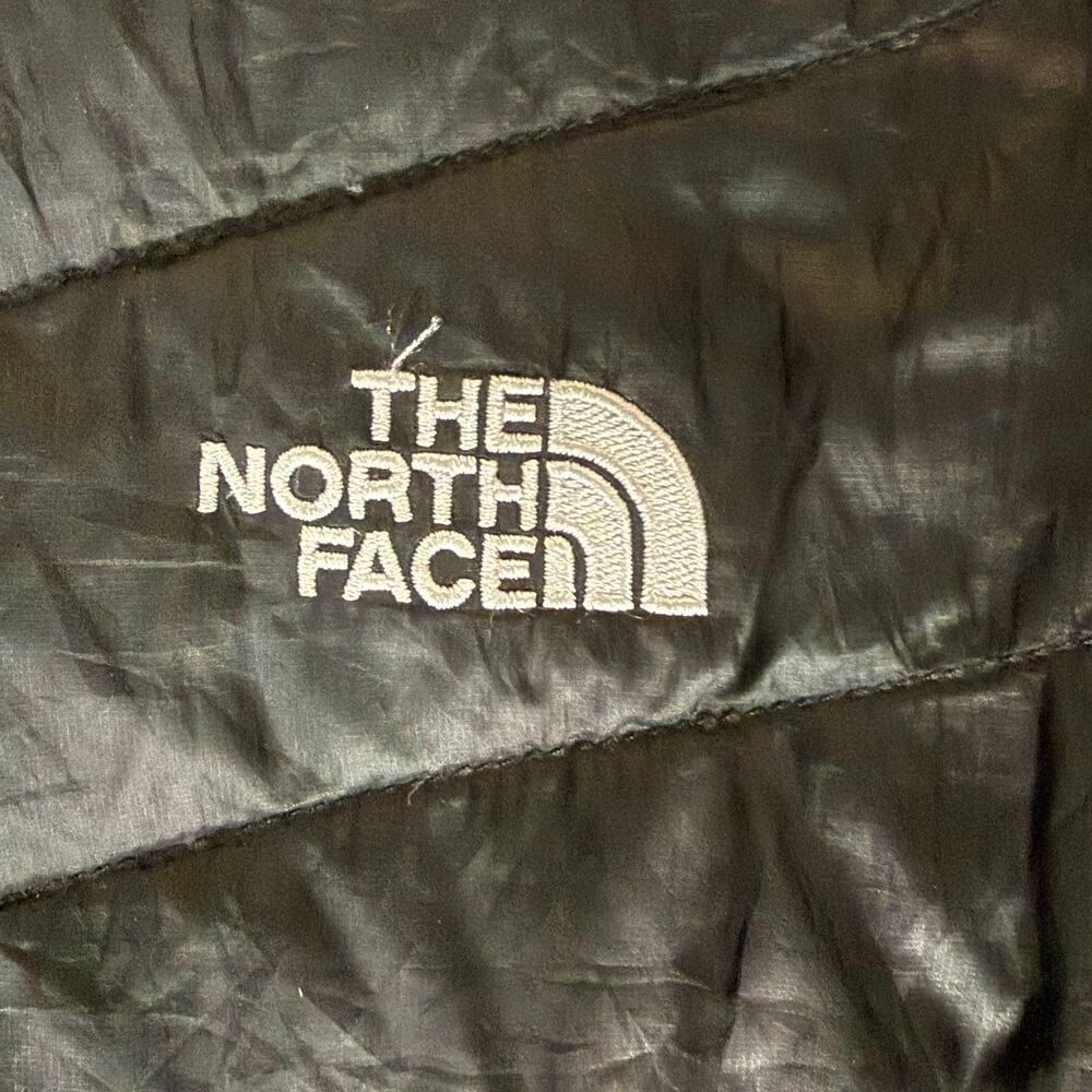 Black North Face Puffer Size M 6-8 pin hole to dimesize blemishes down puffer - Picture 2 of 2